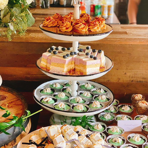 tiers of cupcakes and baked goods