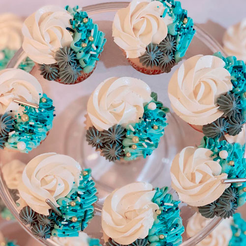 cupcakes with blue icing flowers